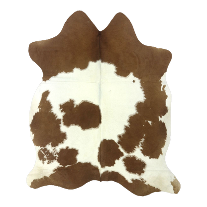 Brown and white cowhide rug, cut-out on transparent background