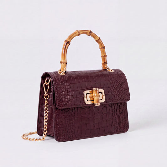 Burgundy Clotilde Bamboo Croc Handbag by Clemés, studio shot