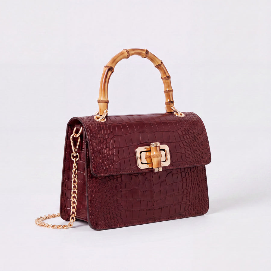 Dark Red Clotilde Bamboo Croc Handbag by Clemés, studio shot