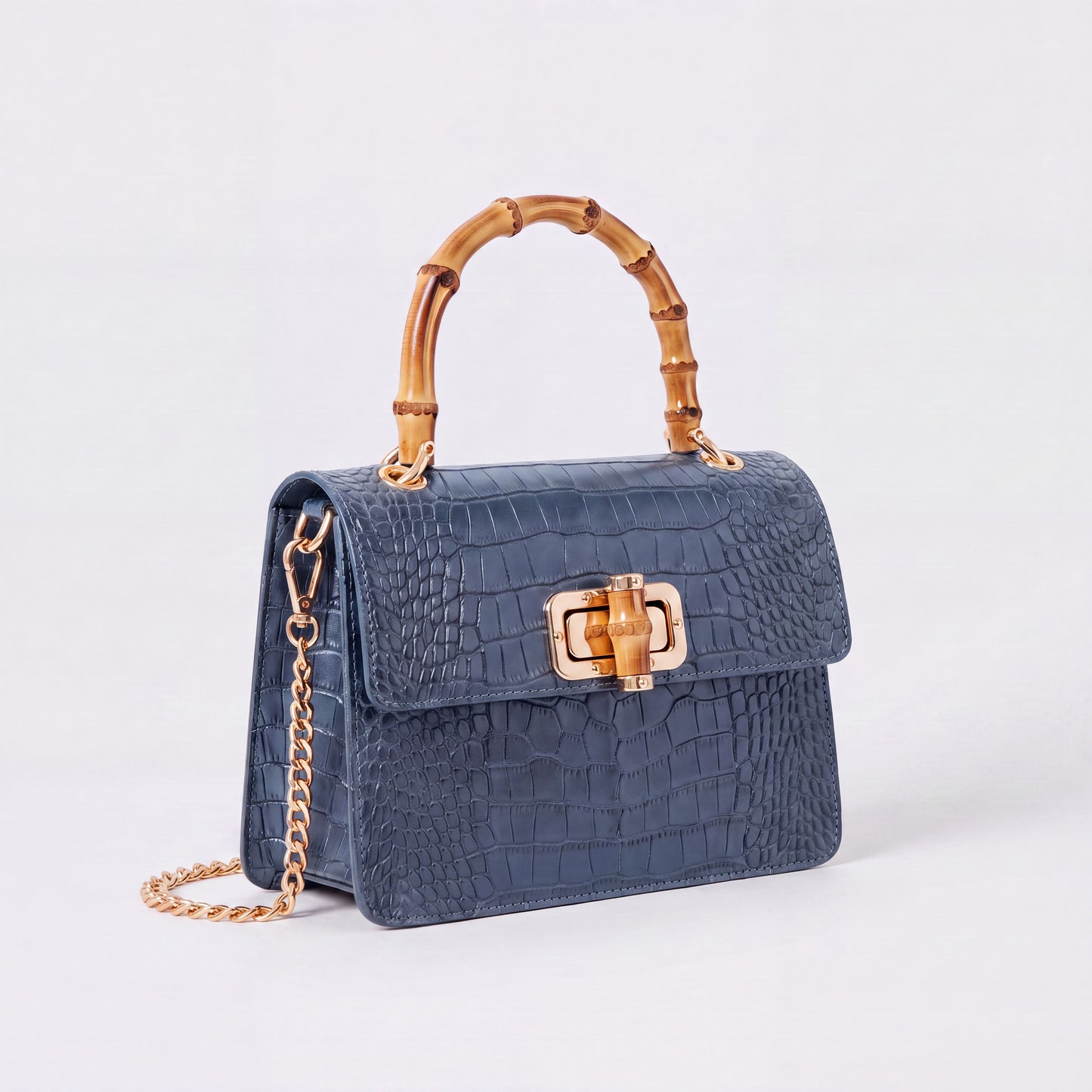 Denim Blue Clotilde Bamboo Croc Handbag by Clemés, studio shot