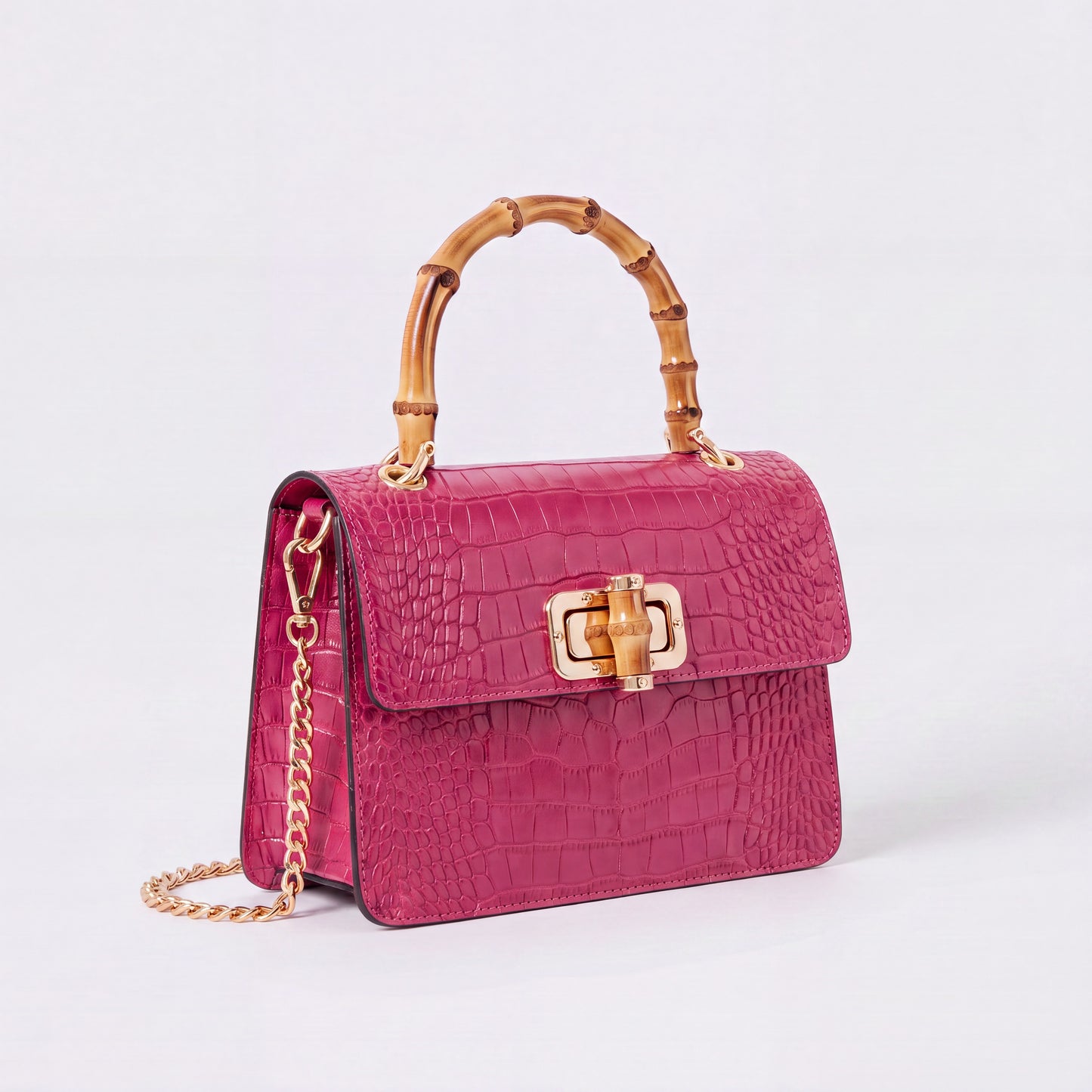 Fuchsia Clotilde Bamboo Croc Handbag by Clemés, studio shot