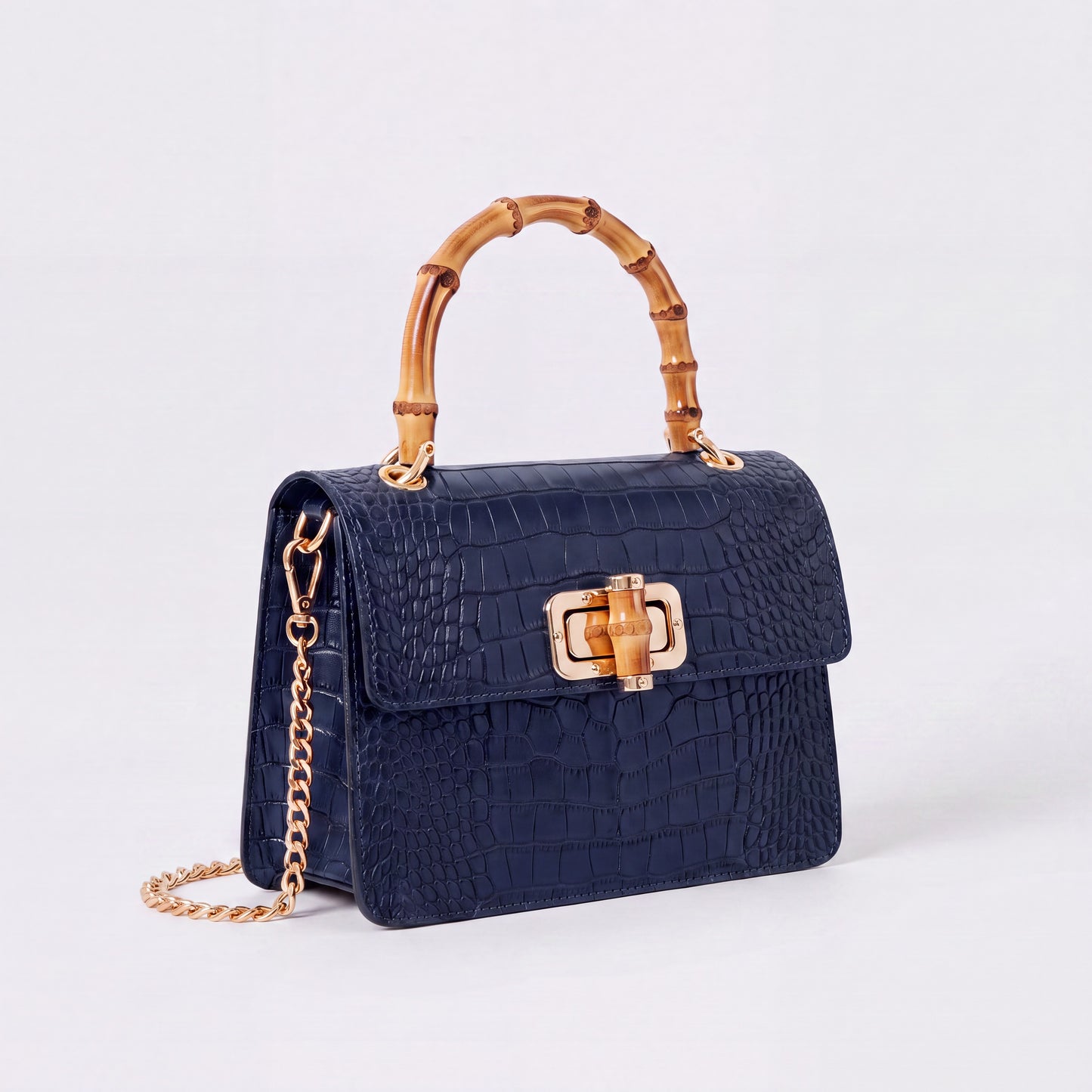 Navy Clotilde Bamboo Croc Handbag by Clemés, studio shot