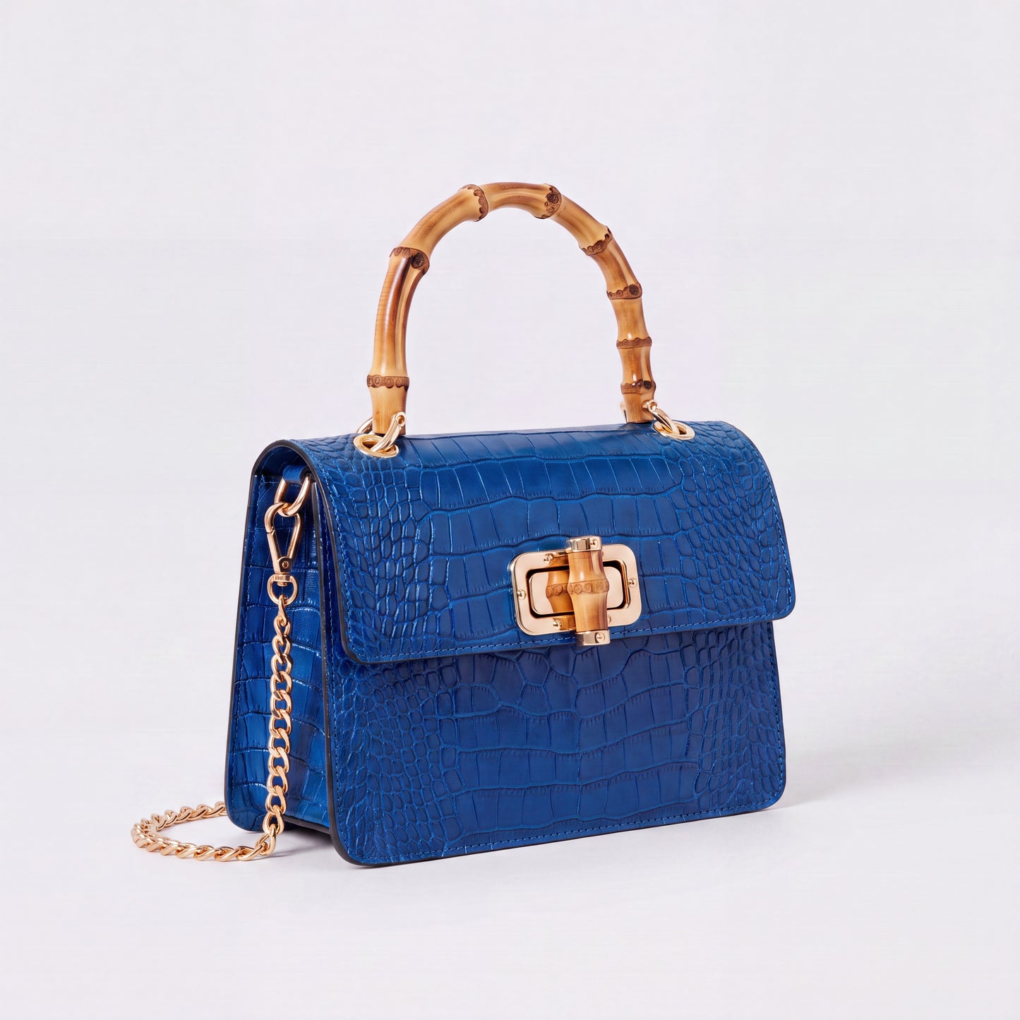 Royal Blue Clotilde Bamboo Croc Handbag by Clemés, studio shot