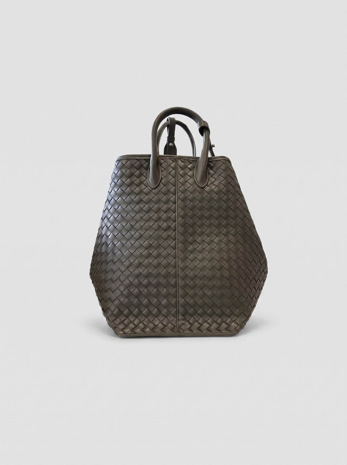 Cloe hand-woven leather bag in tote mode, front view with twin top handles