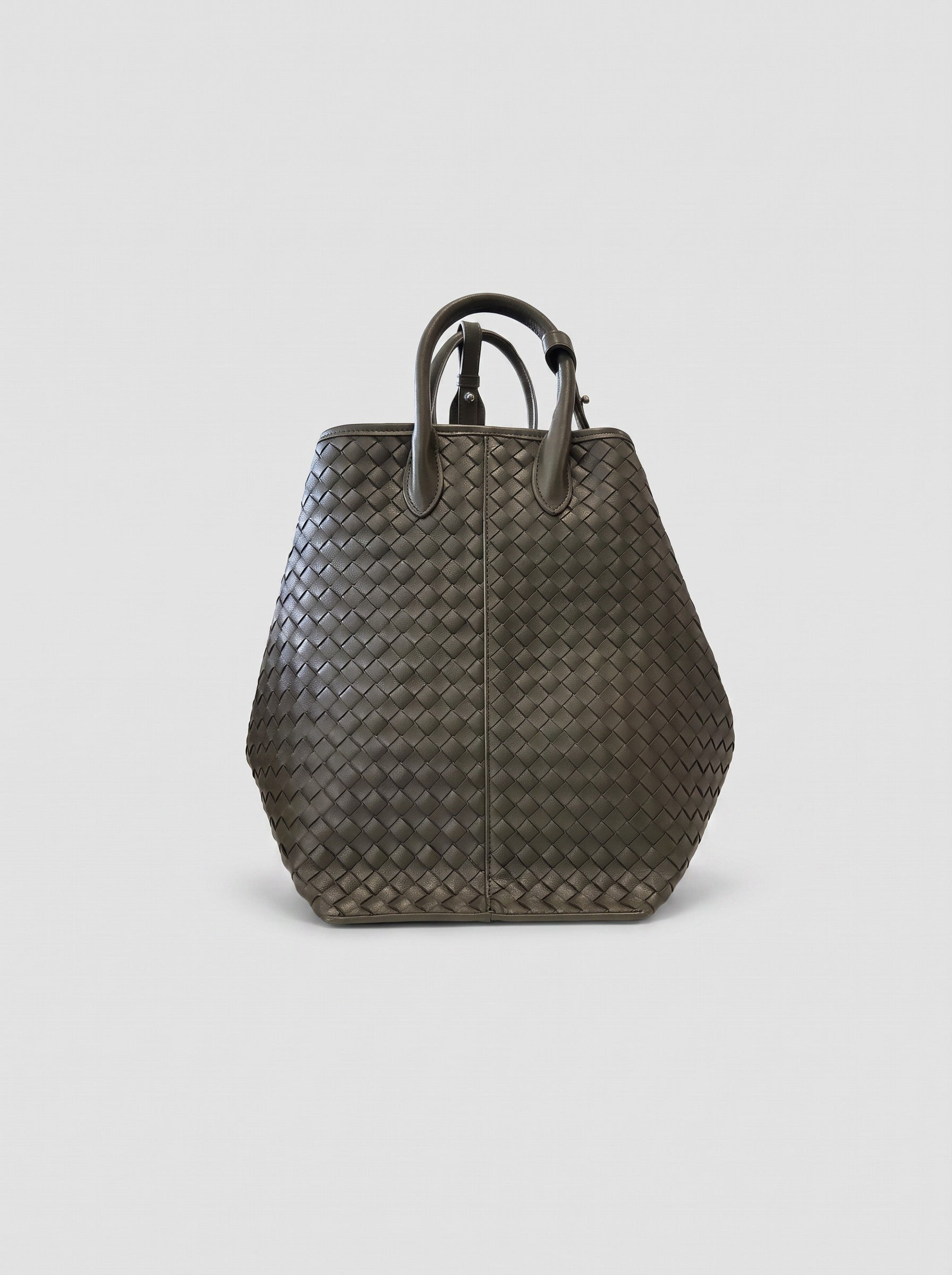 Cloe hand-woven leather bag in tote mode, front view with twin top handles