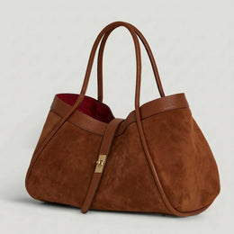 Bianca Large Suede Handbag by Clemés in Brown, three-quarter studio shot on grey background