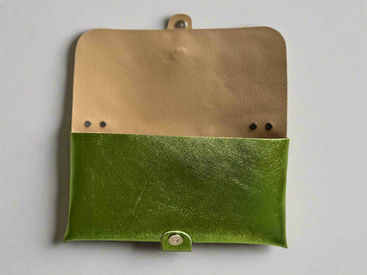 Anima Suede Leather Metallic Clutch Shoulder Bag by Clemés in Apple Green, flat lay showing the nude leather flap