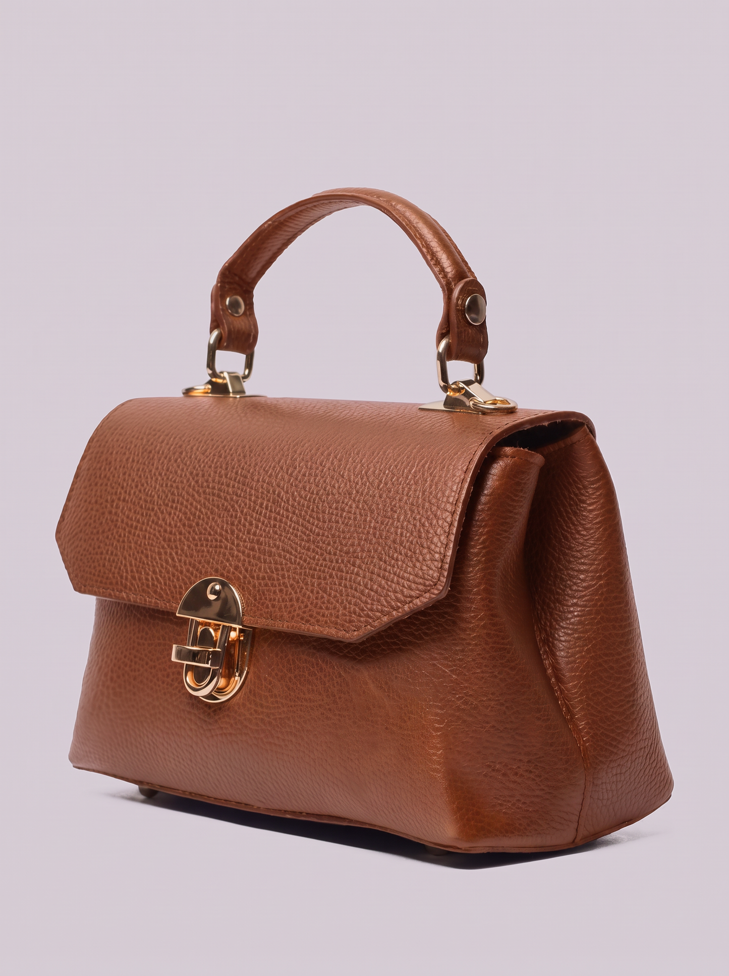 Clemés Lola Dollaro crossbody bag in Cognac leather, three-quarter view