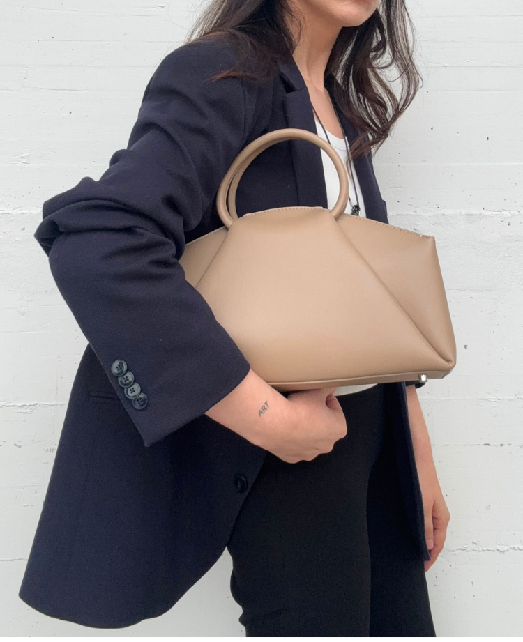 Alix leather top-handle bag by Clemés styled in taupe
