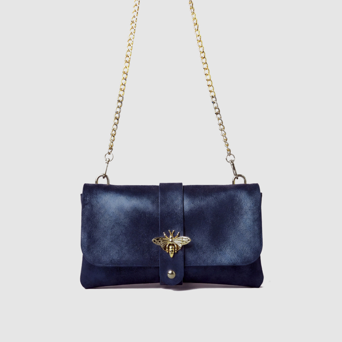 Anima Suede Leather Metallic Clutch Shoulder Bag by Clemés in Navy, studio shot on grey background