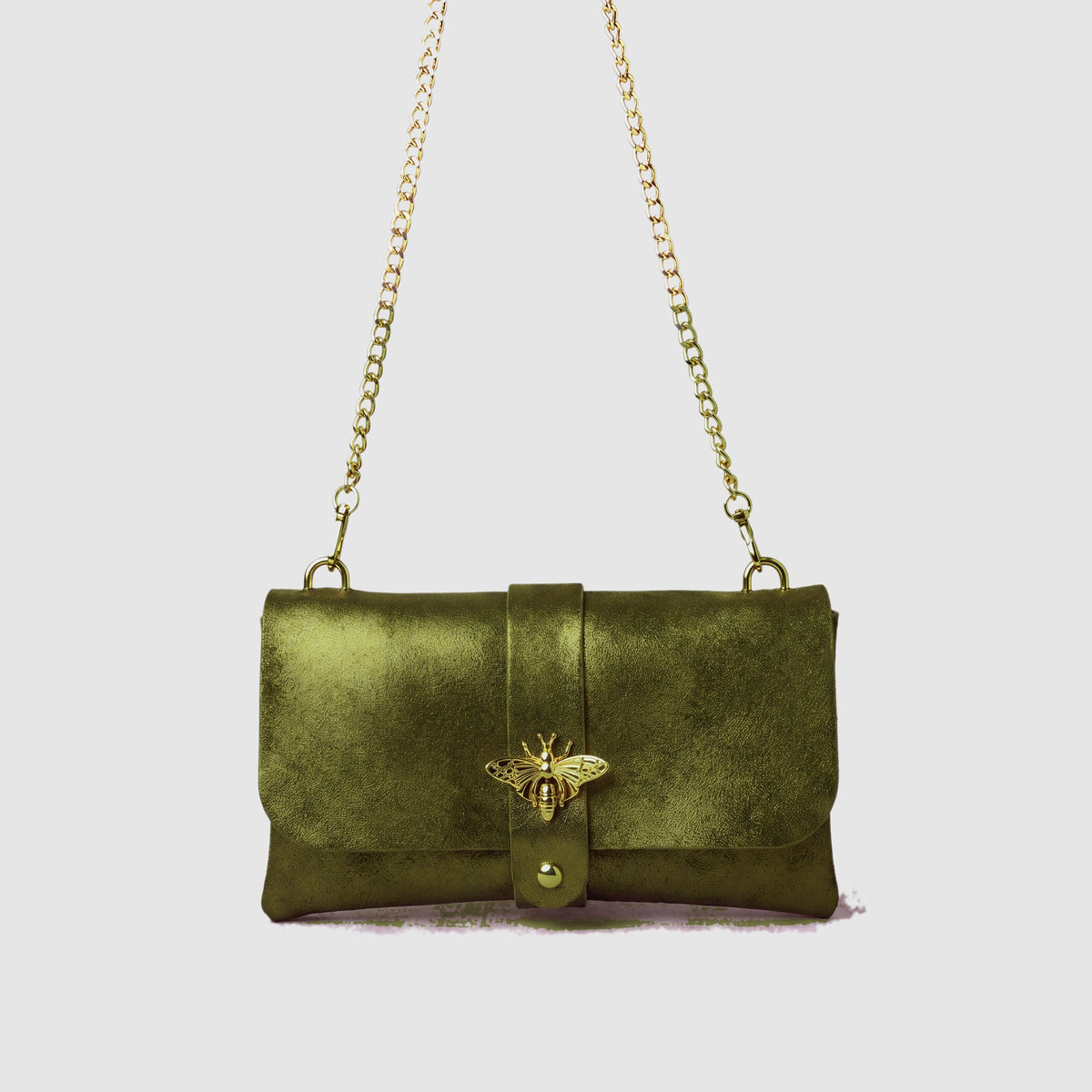 Anima Suede Leather Metallic Clutch Shoulder Bag by Clemés in Olive, studio shot on grey background