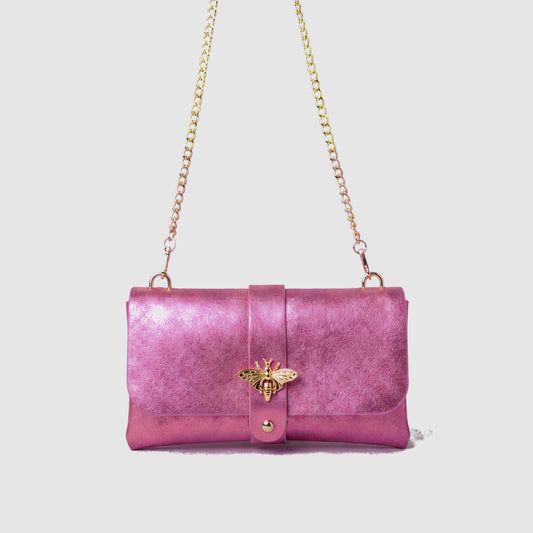 Anima Suede Leather Metallic Clutch Shoulder Bag by Clemés in Rose, studio shot on grey background