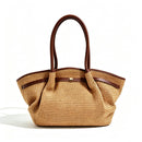 Serafina Raffia & Leather Shopper by Clemés in Dark Brown, three-quarter studio shot on grey background