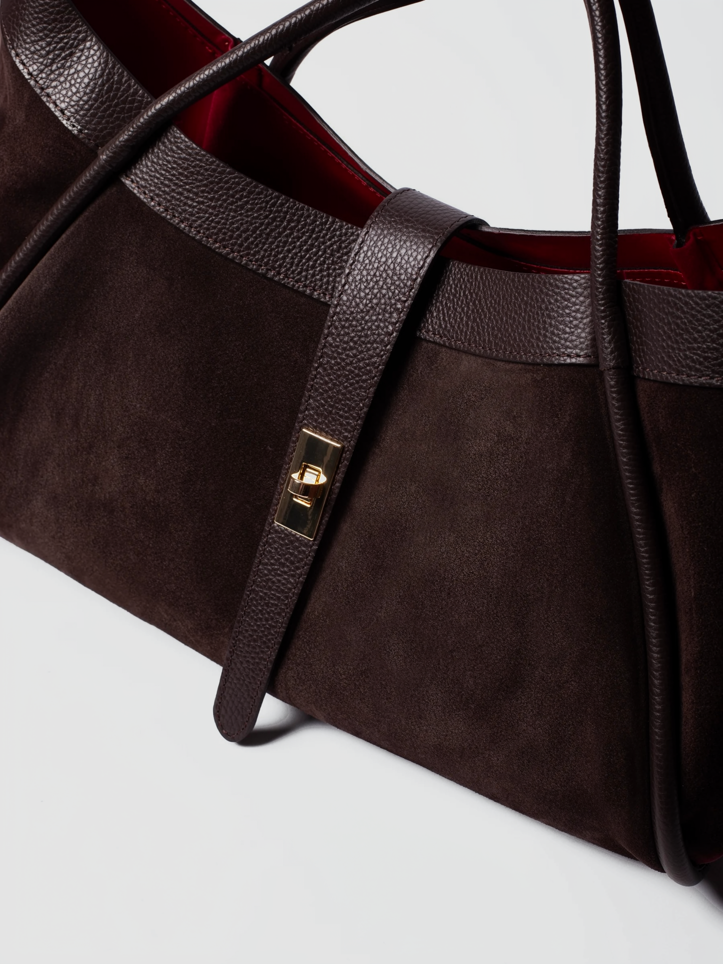 Bianca Large Suede Handbag by Clemés in Dark Brown, close-up of the turn-lock closure and strap