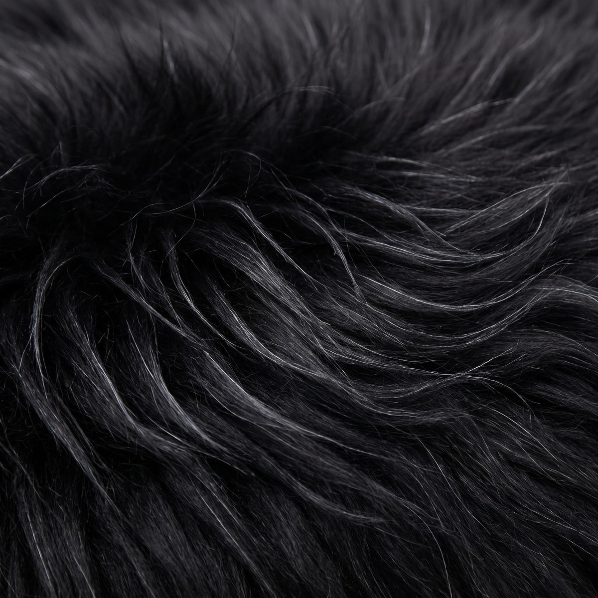 Close-up of Black long wool sheepskin fibres