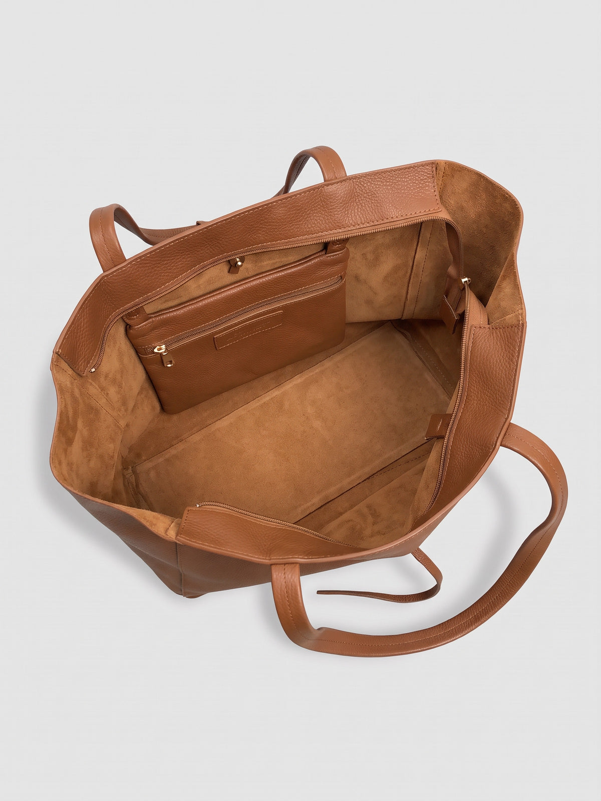 Carlotta oversized leather tote by Clemés in Dark Tan leather, interior view showing the tan suede lining and zip pocket