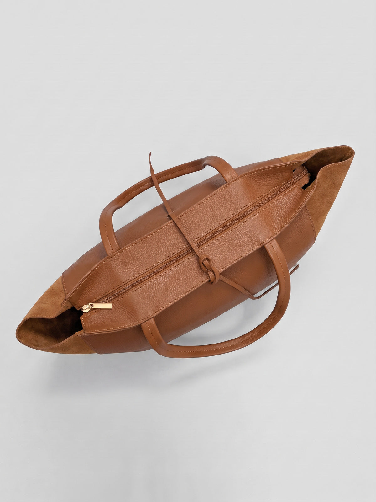 Carlotta oversized leather tote by Clemés in Dark Tan leather, top-down view of the closed top zip and handles