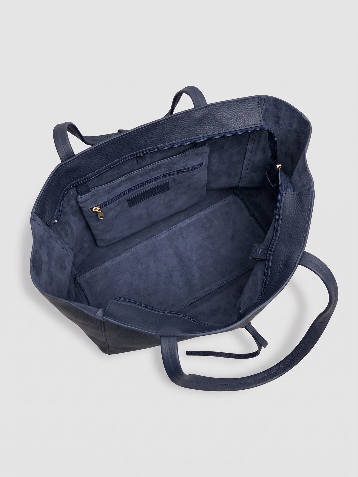 Carlotta oversized leather tote by Clemés in Navy leather, interior view showing the navy suede lining and zip pocket