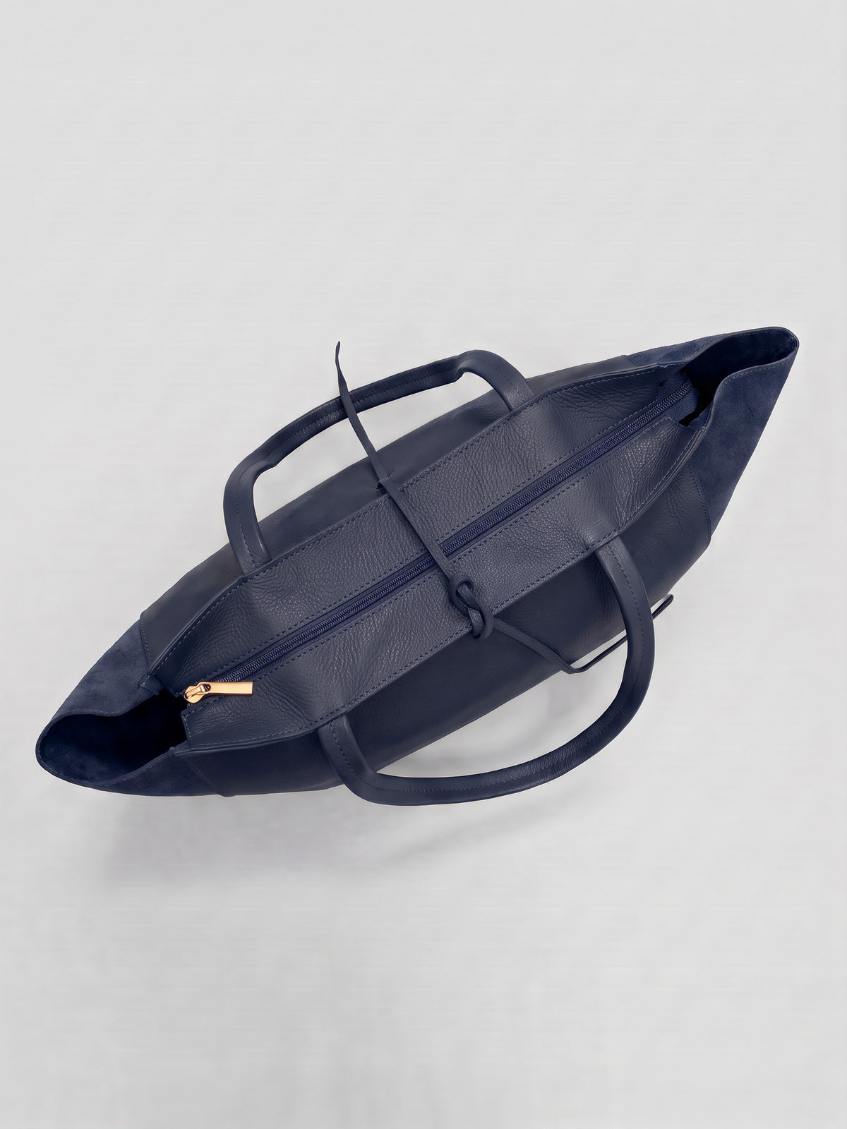 Carlotta oversized leather tote by Clemés in Navy leather, top-down view of the closed top zip and handles