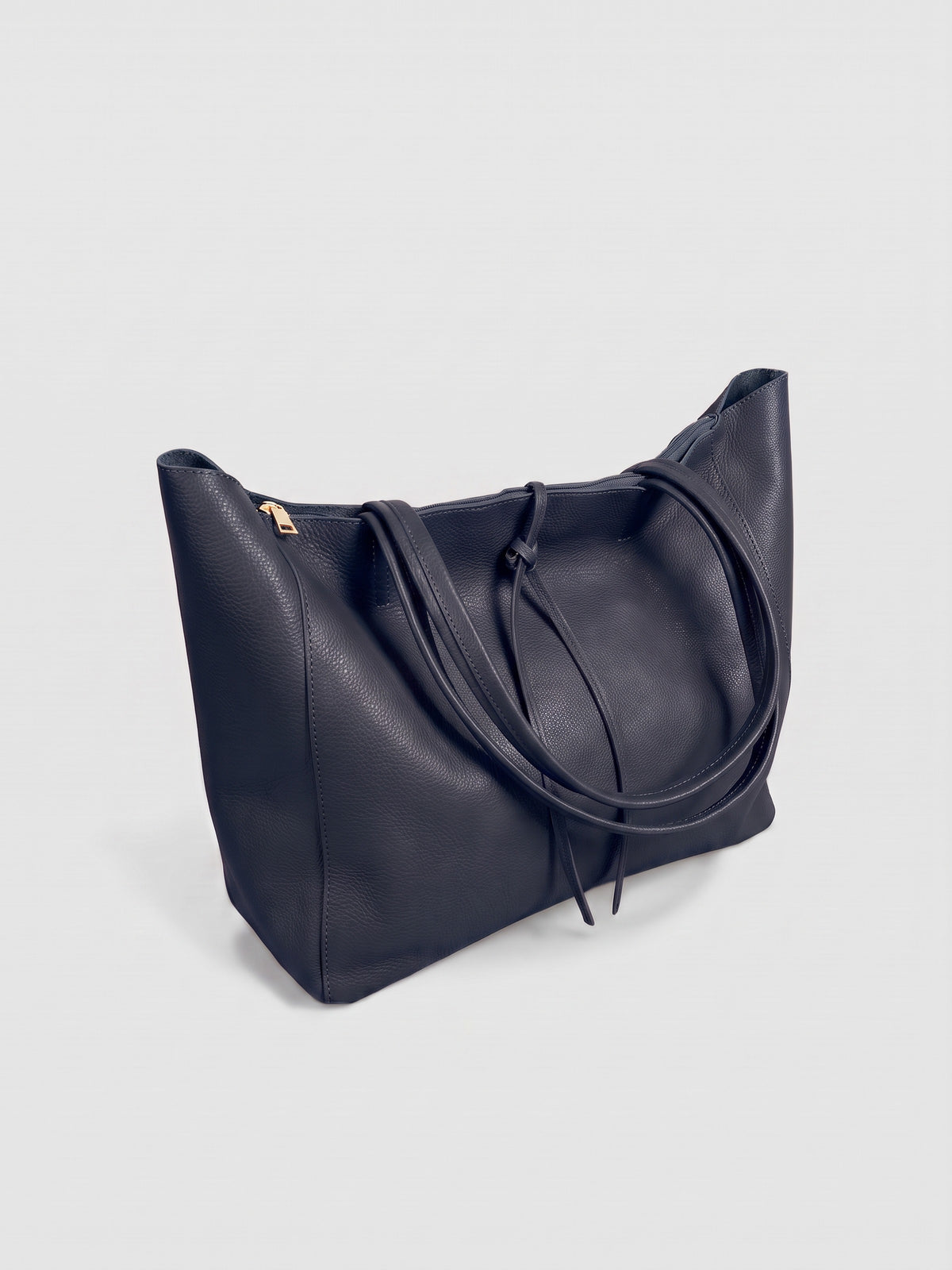 Carlotta oversized leather tote by Clemés in Navy leather, three-quarter studio view