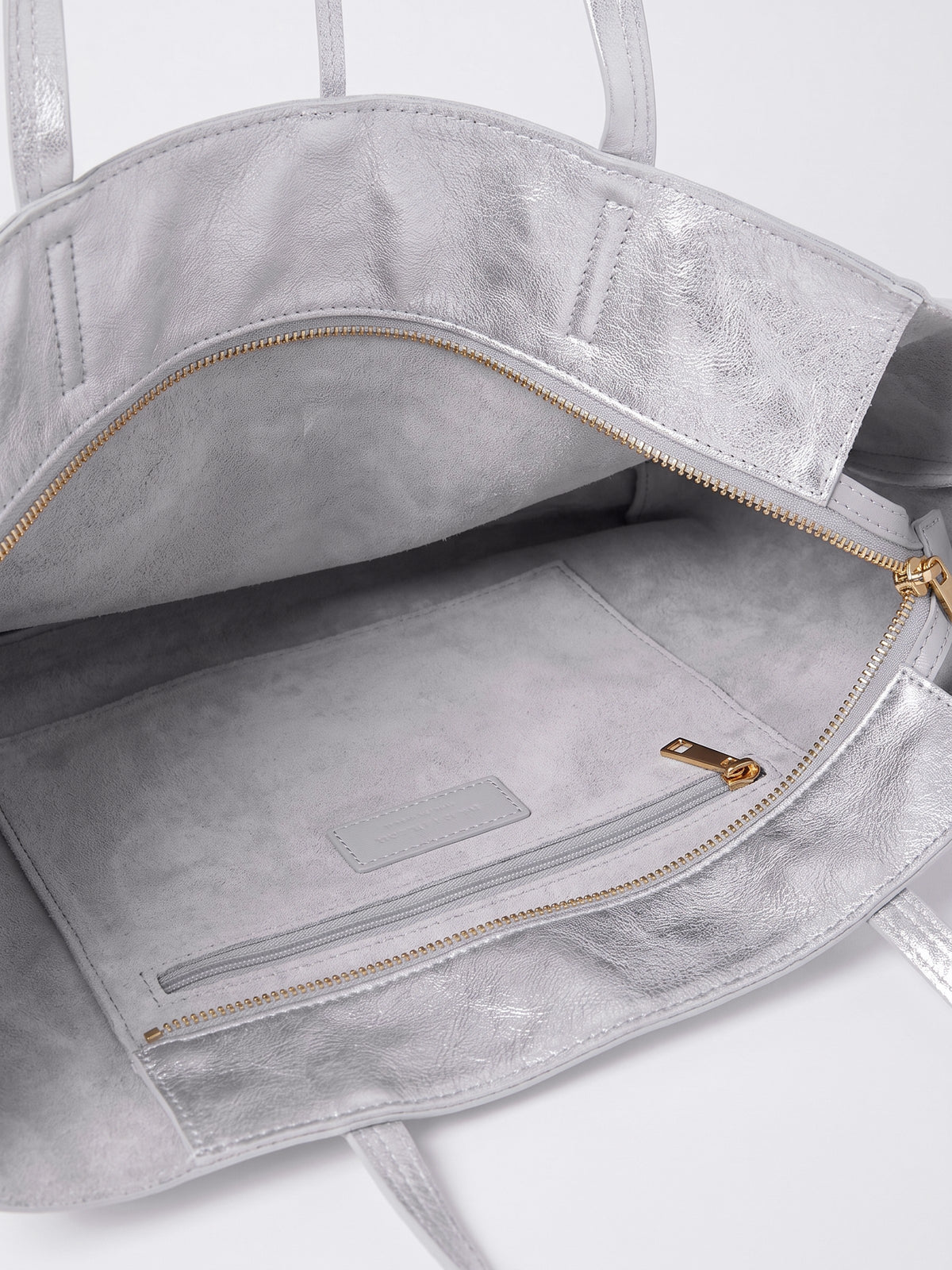 Carlotta oversized leather tote by Clemés in Silver metallic leather, inside zip pocket and top zip detail