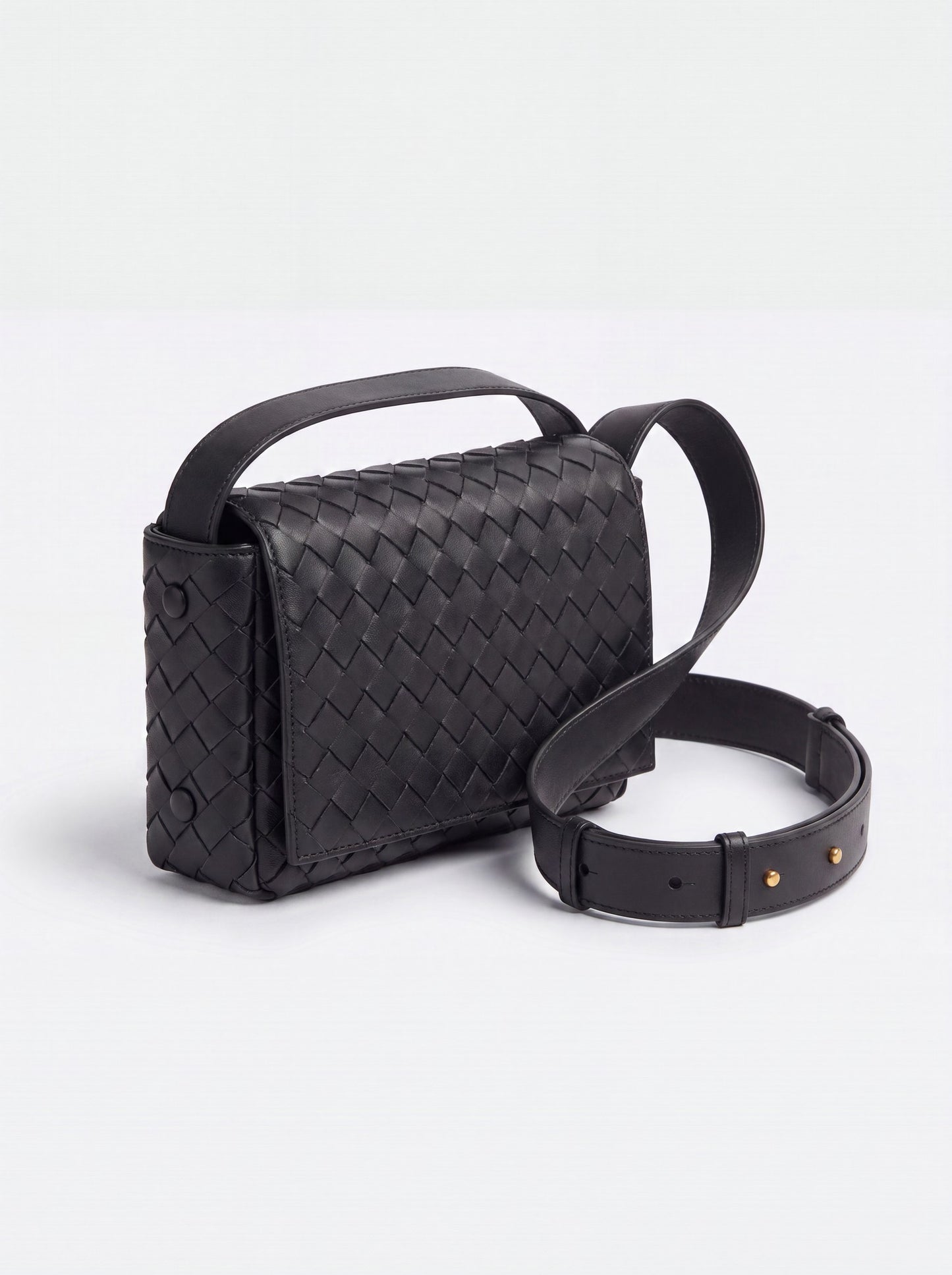 Elettra woven leather crossbody bag by Clemés in Black, studio three-quarter view