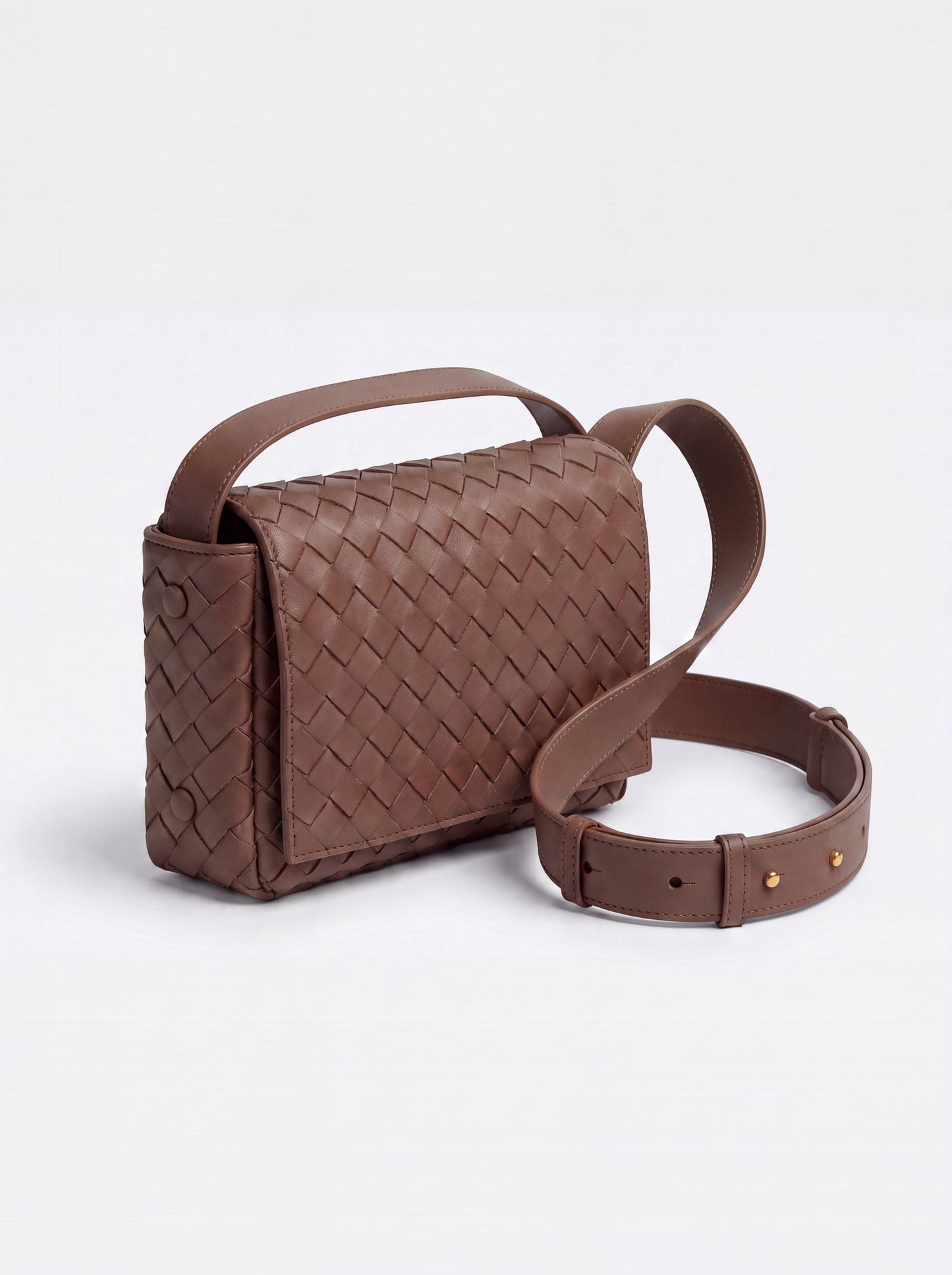 Elettra woven leather crossbody bag by Clemés in Brown, studio three-quarter view