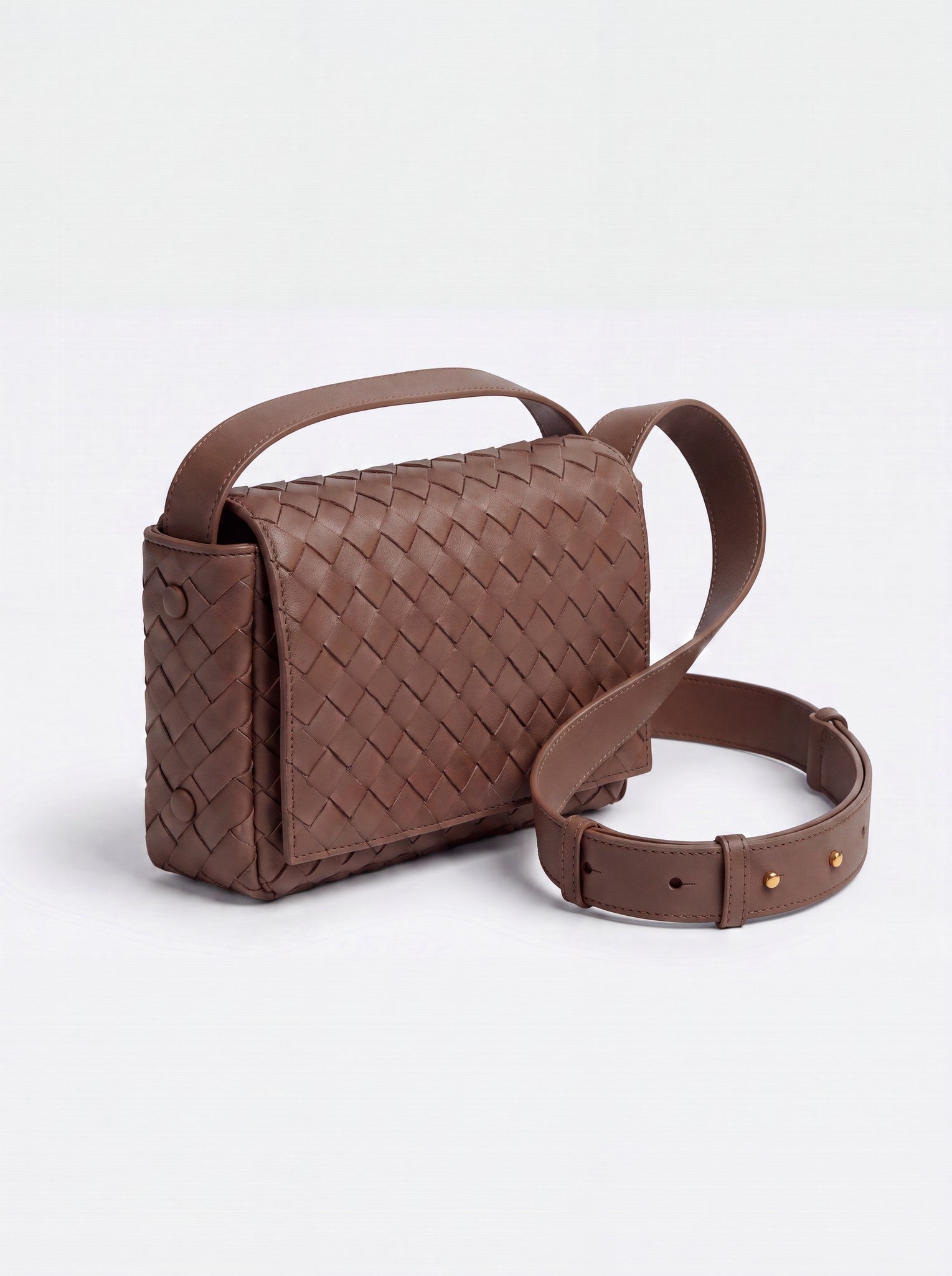 Elettra woven leather crossbody bag by Clemés in Brown, studio three-quarter view