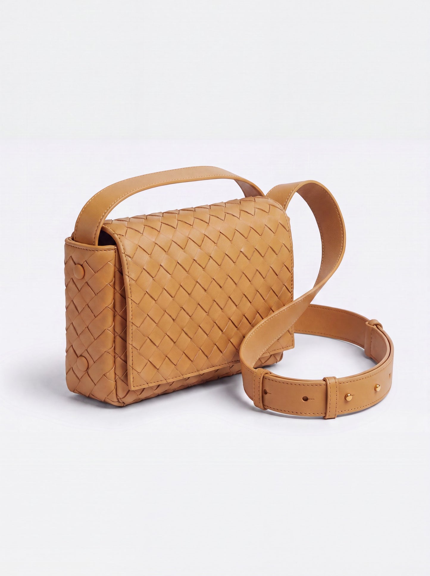 Elettra woven leather crossbody bag by Clemés in Cognac, studio three-quarter view