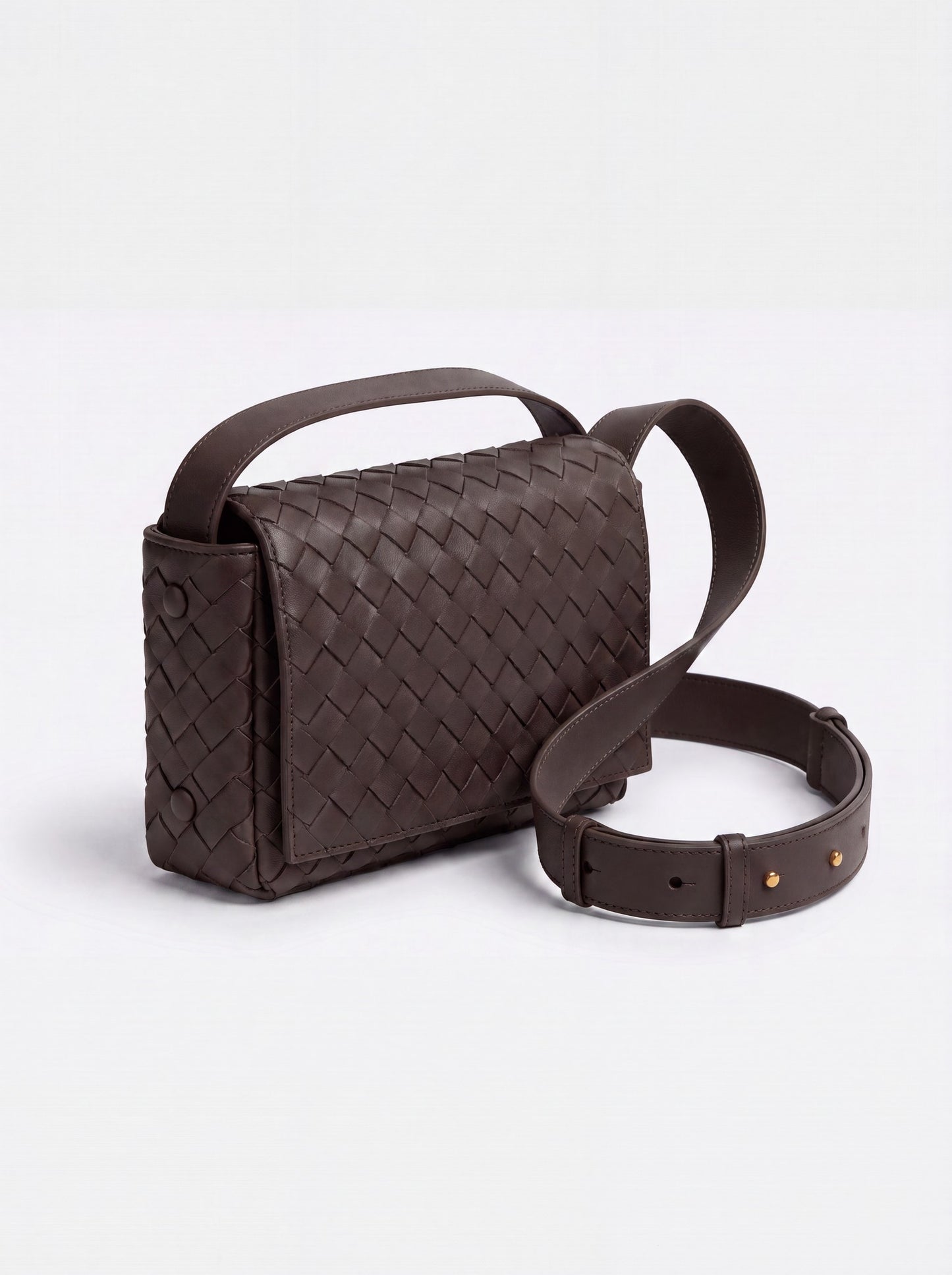 Elettra woven leather crossbody bag by Clemés in Dark Brown, studio three-quarter view