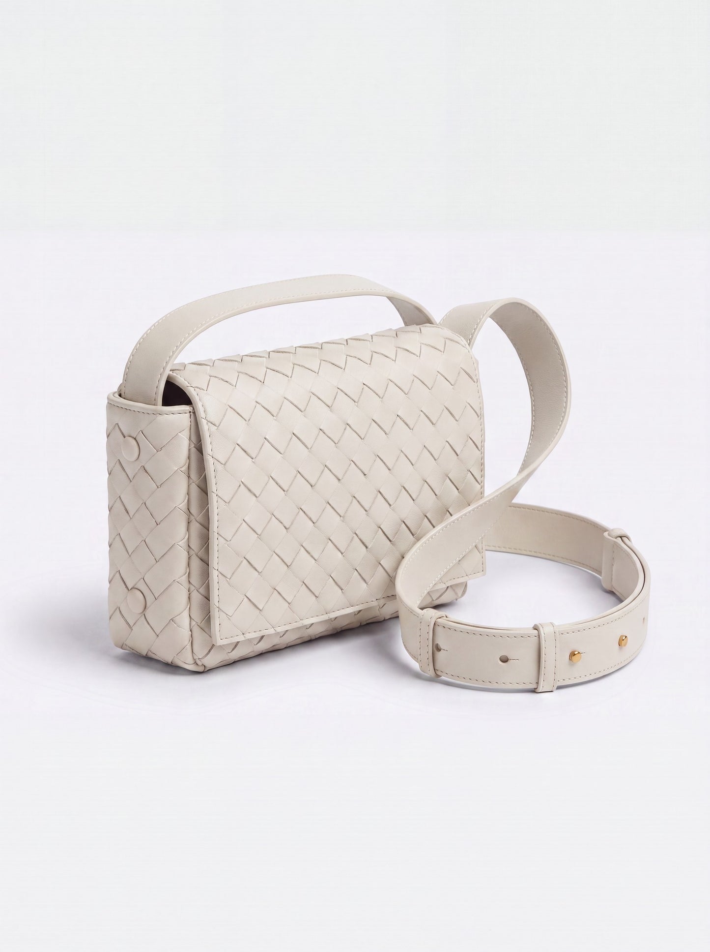 Elettra woven leather crossbody bag by Clemés in White, studio three-quarter view