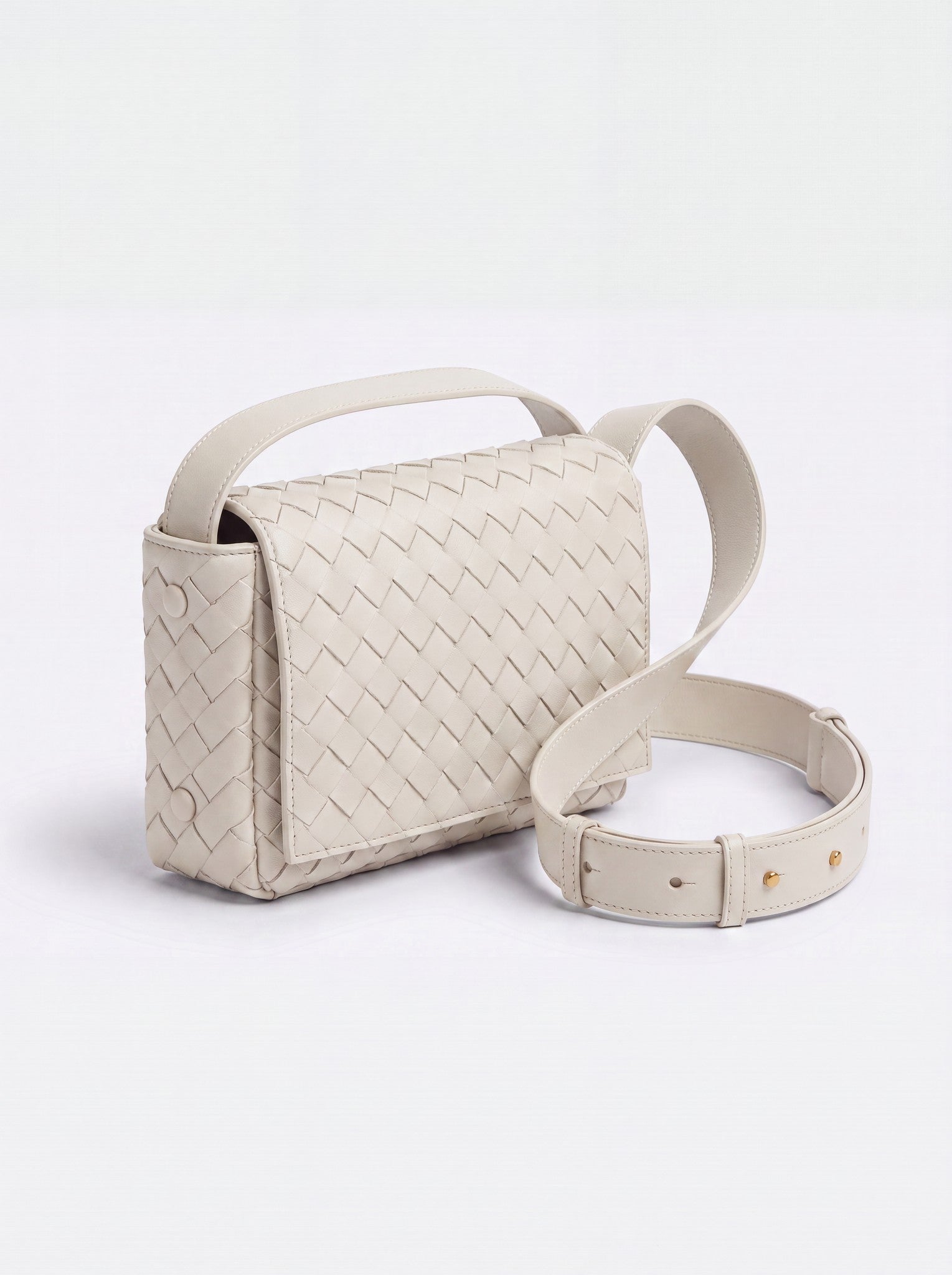 Elettra woven leather crossbody bag by Clemés in White, studio three-quarter view