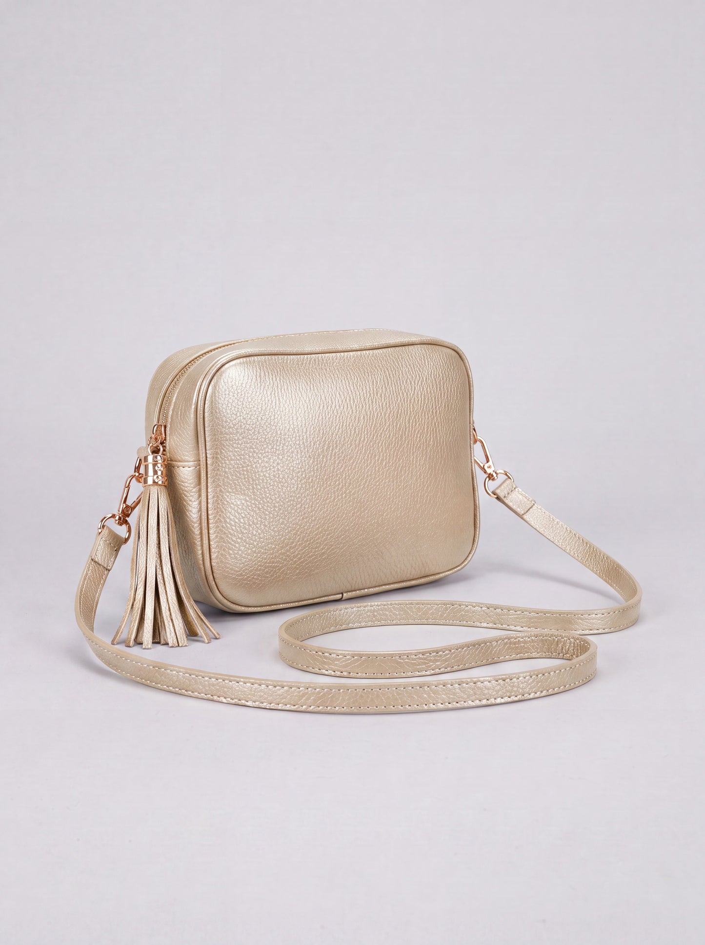 Éloise Leather Tassel Camera Bag by Clemés in Metallic Gold — studio product photo