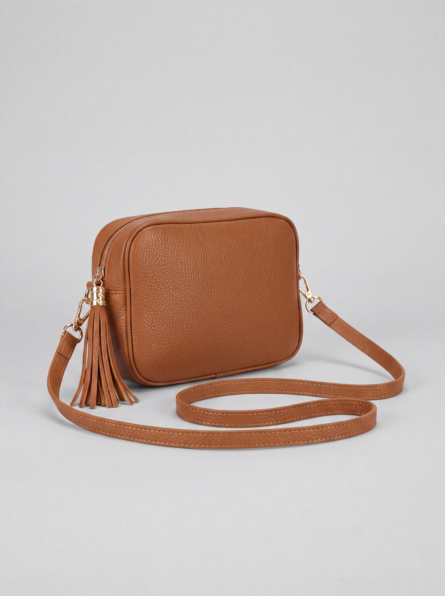 Éloise Leather Tassel Camera Bag by Clemés in Tan — studio product photo