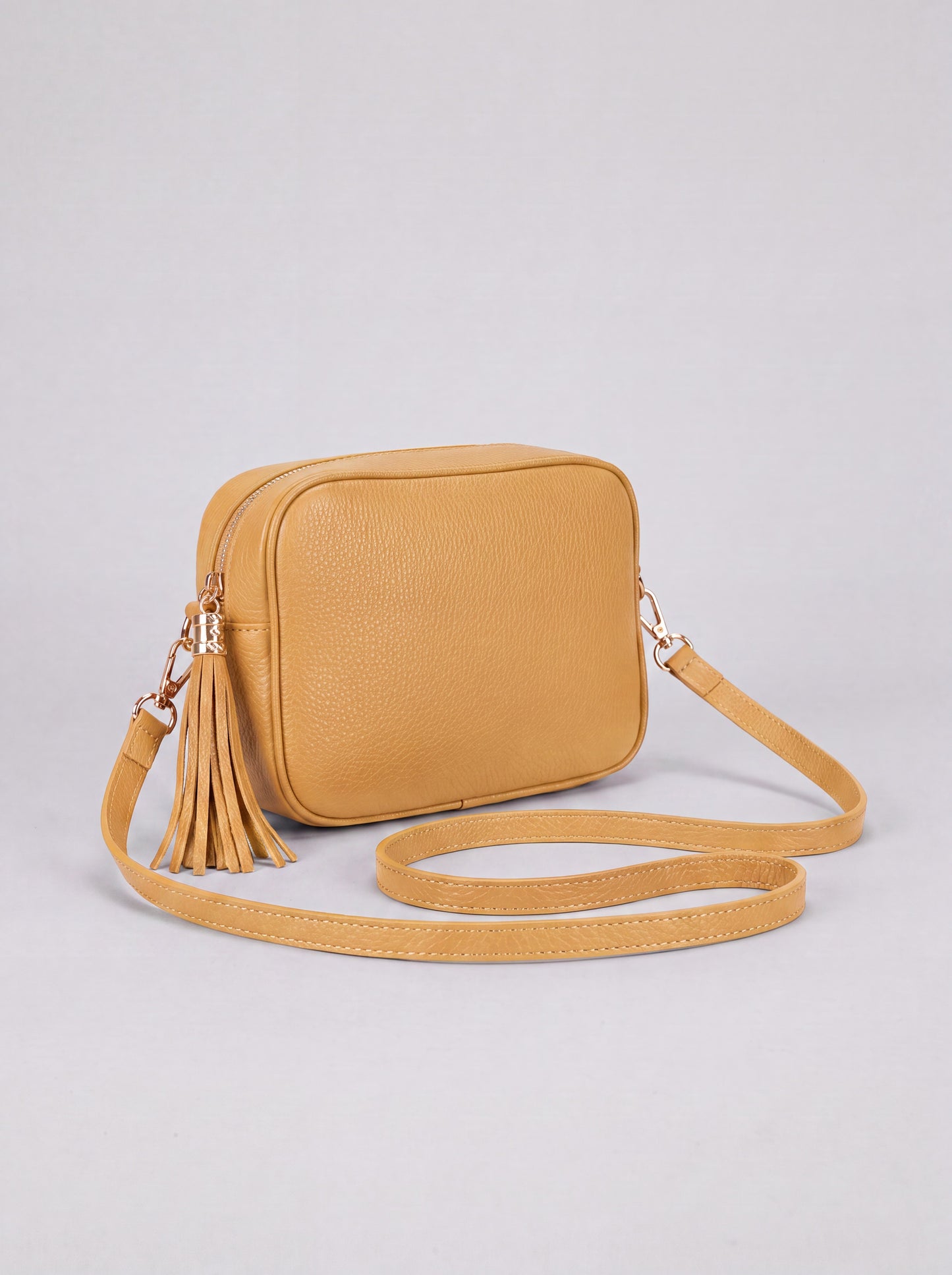 Éloise Leather Tassel Camera Bag by Clemés in Yellow — studio product photo