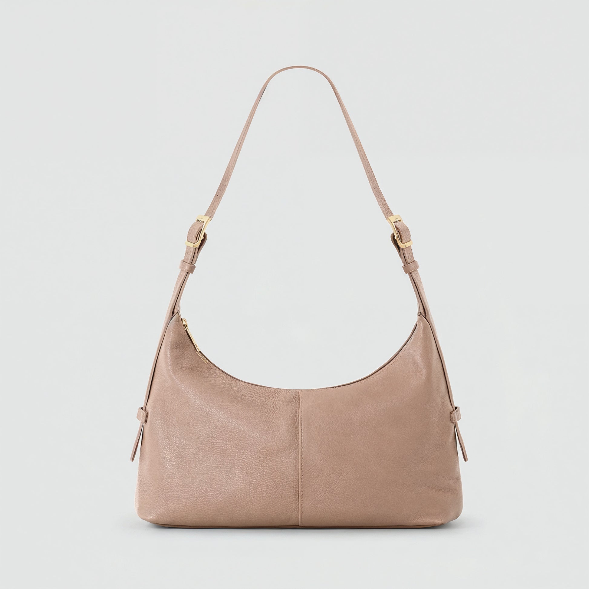 Elettra leather shoulder bag in dusty rose on a light grey studio background