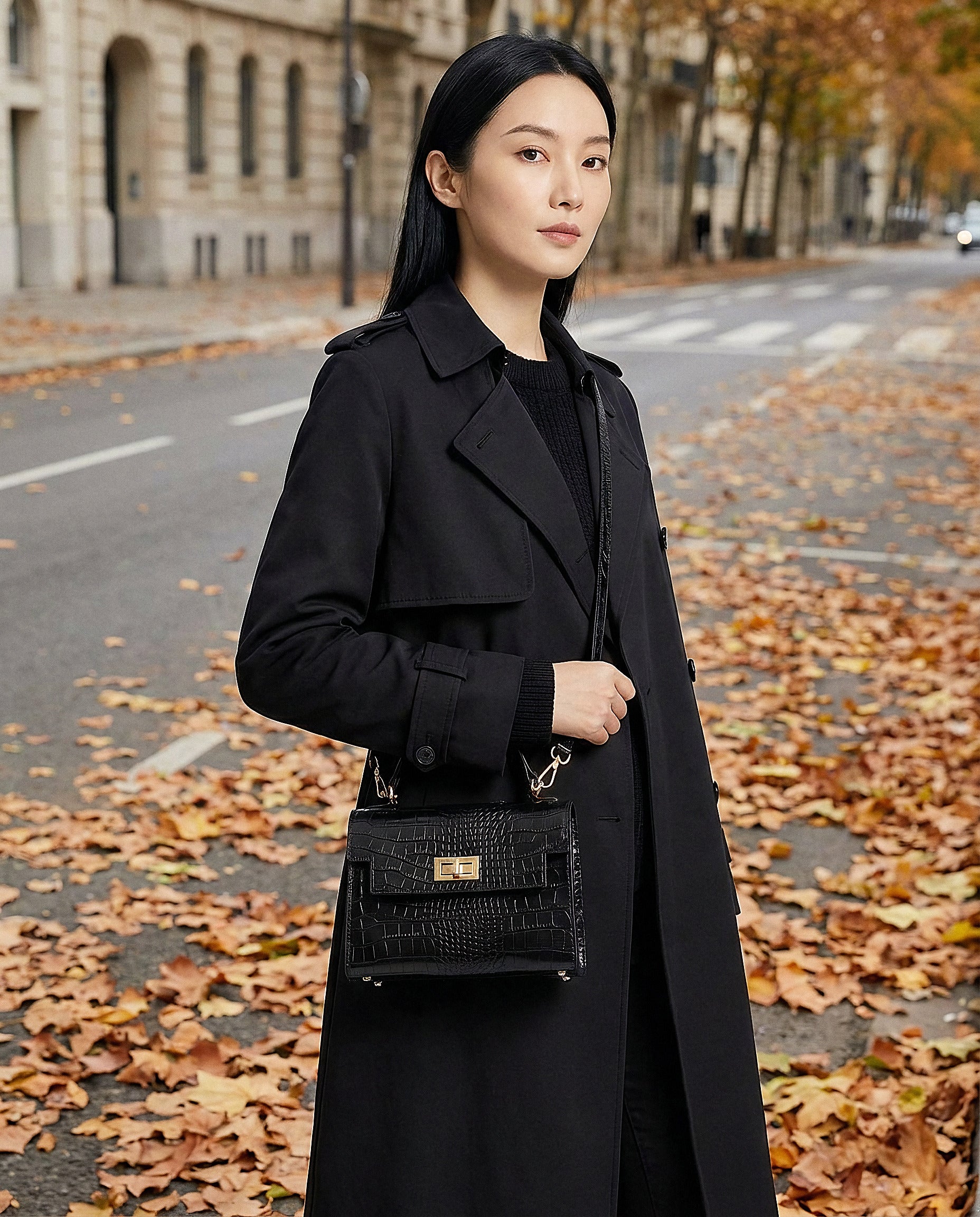 Woman with the Black Margot Croc crossbody bag on an autumn city street