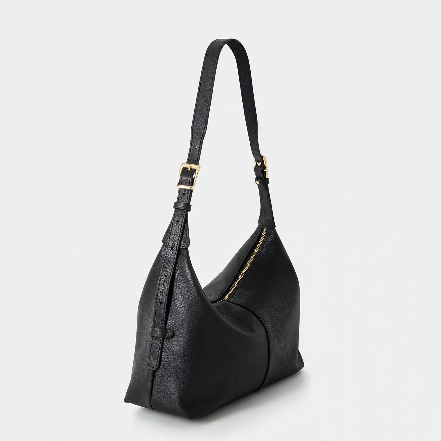 Elettra leather shoulder bag in black, alternate view, light grey studio background