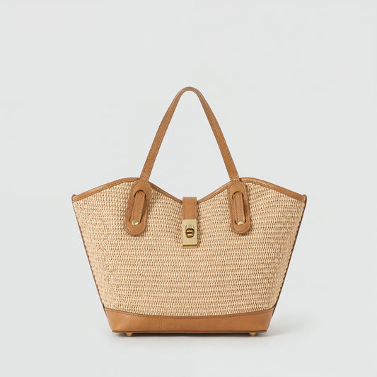 Sorrento raffia and tan leather tote, front view on a light grey studio background