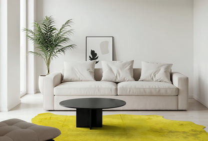 Acid wash yellow cowhide rug, close framing, in a bright minimalist living room