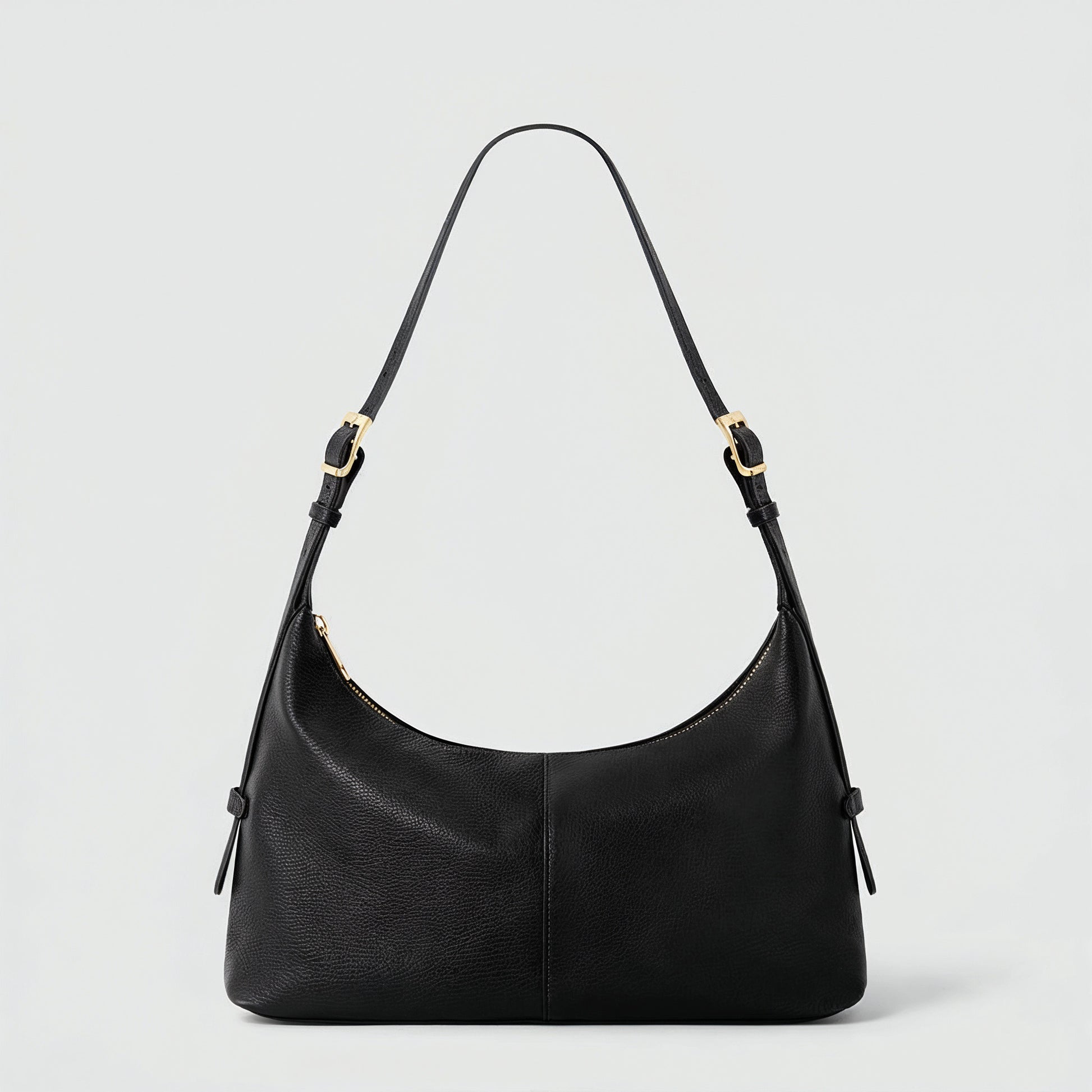 Elettra leather shoulder bag in black on a light grey studio background