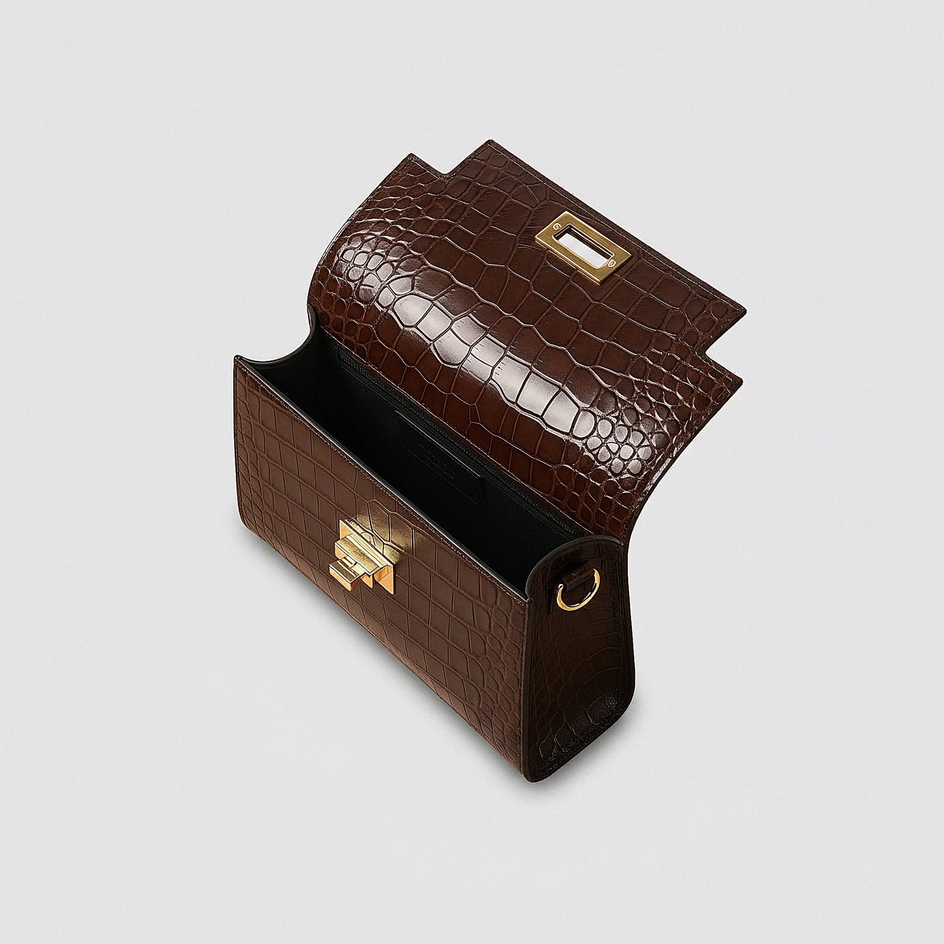 Margot Croc crossbody bag open showing the interior lining, studio product photo on grey background
