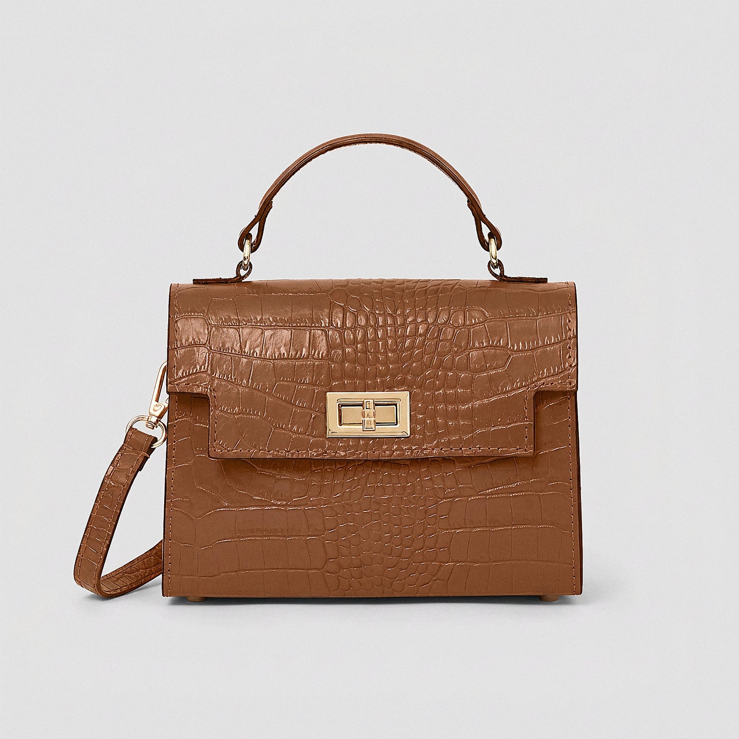 Tan Margot Croc crossbody bag, studio product photo on grey background