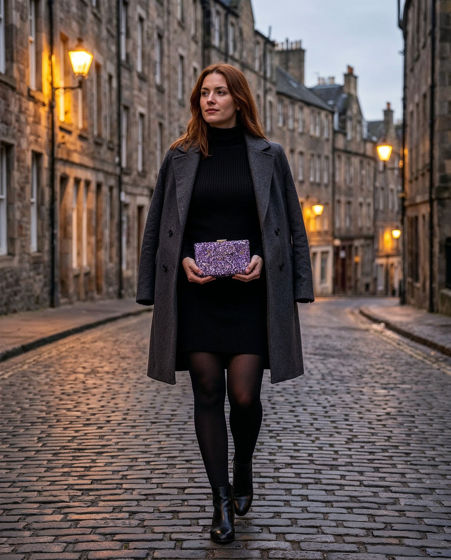 Woman holding the Violet Gemma Natural Stone Box Clutch on a cobbled Edinburgh Old Town street at dusk