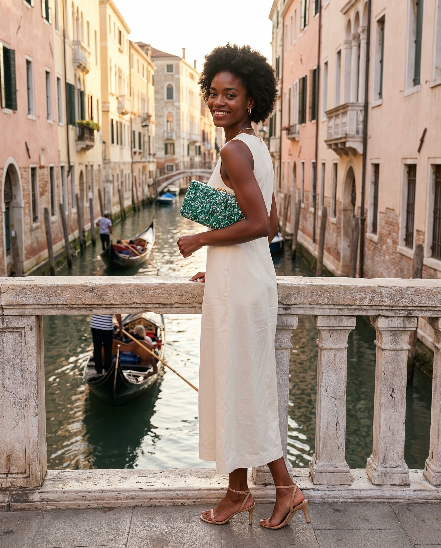 Woman with the Turquoise Gemma Natural Stone Box Clutch on a Venice canal bridge at golden hour