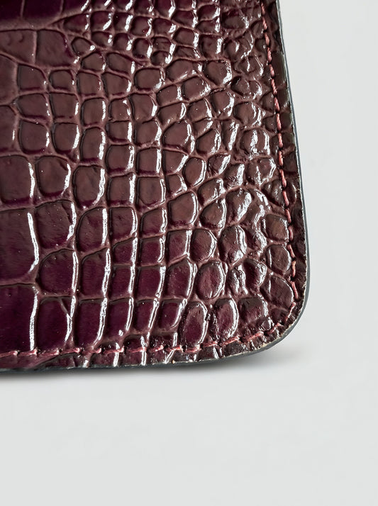 Clotilde Bamboo Croc Handbag by Clemés - Burgundy - close-up of crocodile-embossed leather corner detail