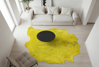 Acid wash yellow cowhide rug viewed from above in a minimalist living room