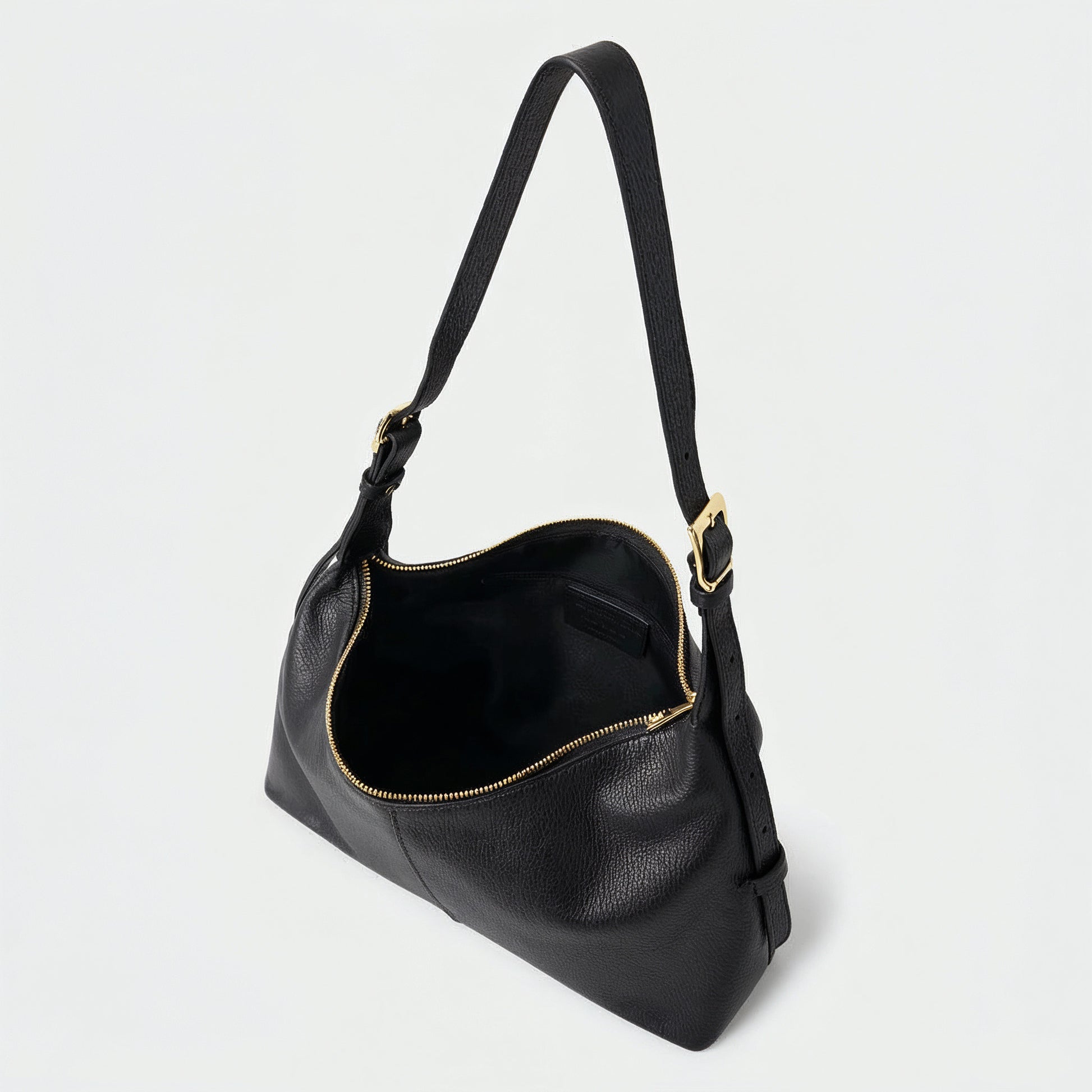 Elettra leather shoulder bag in black on a light grey studio background