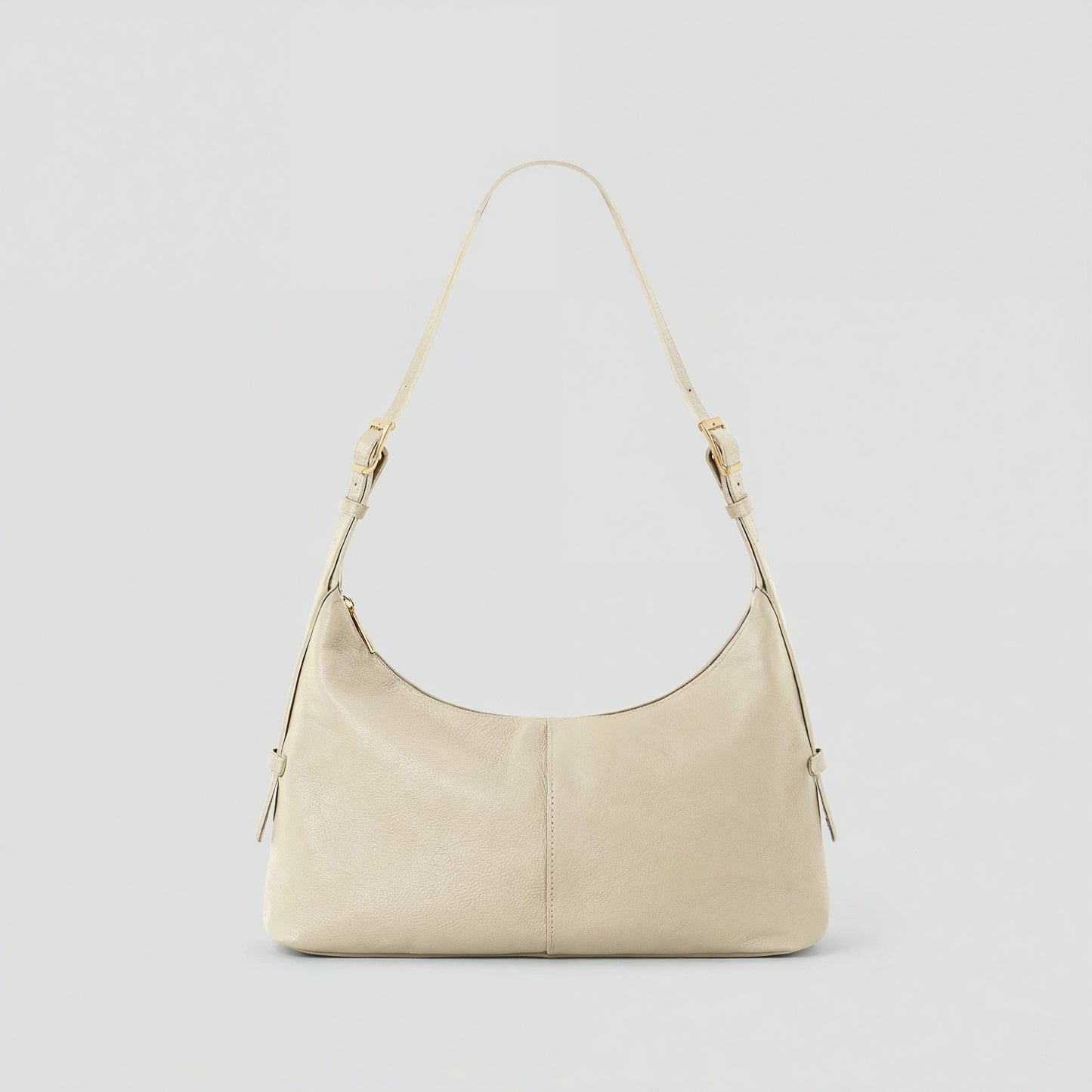Elettra leather shoulder bag in ivory on a light grey studio background