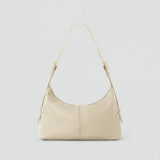 Elettra leather shoulder bag in ivory on a light grey studio background